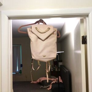 Baby pink leather Victoria Secret draw string backpack with gold chain detail